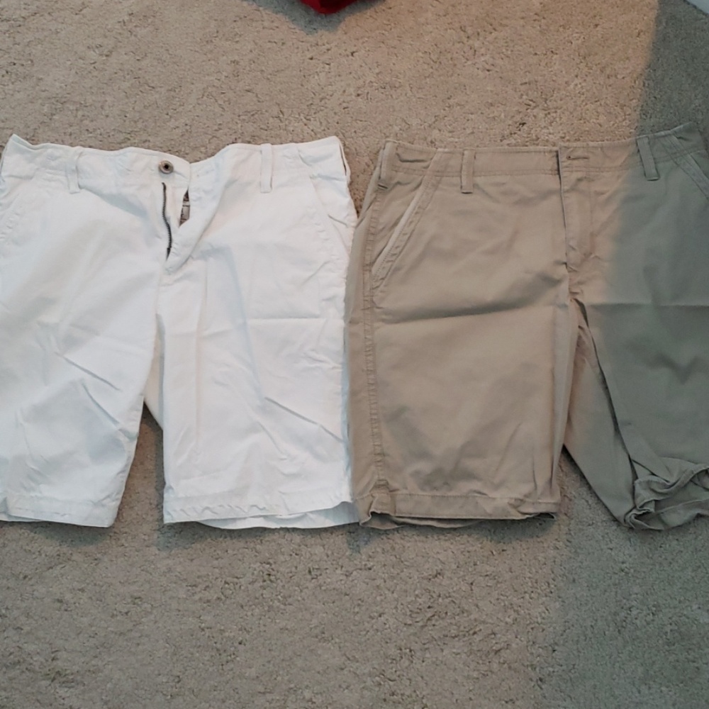 Two pairs of shorts, white and tan